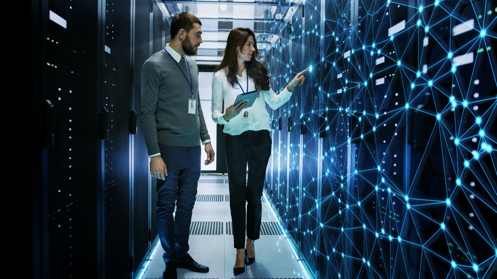 IT consultants reviewing a data migration in a server environment