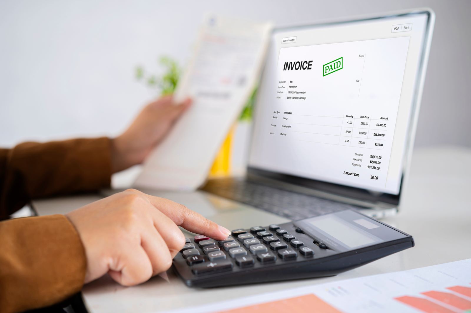 Reviewing an invoice and calculating implementation costs
